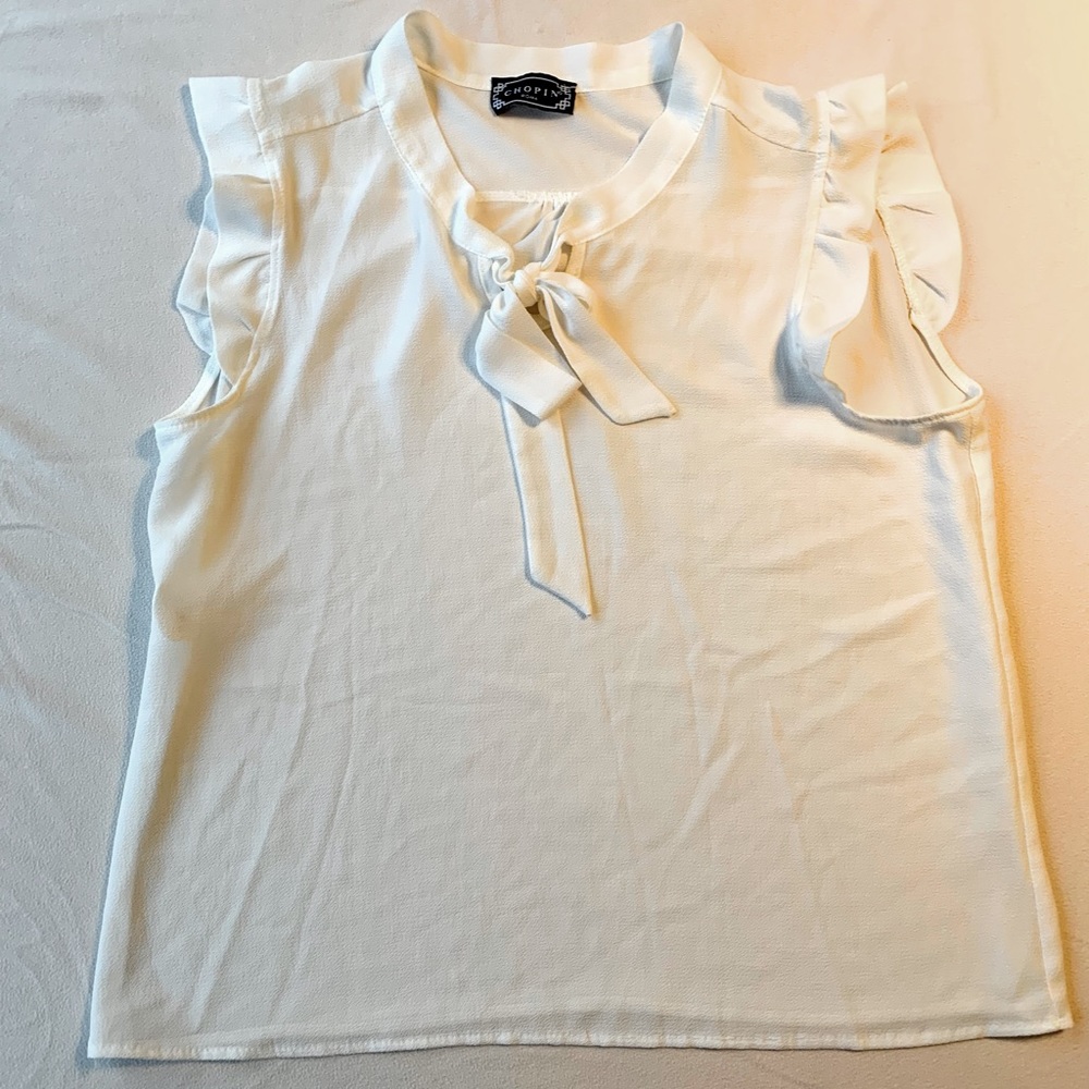 Beautiful, White, Chopin tank top with ruffled capped sleeves and a neck tie.